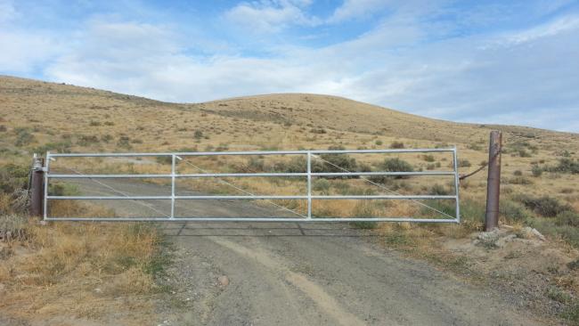 Unlocked gate east side of orchard