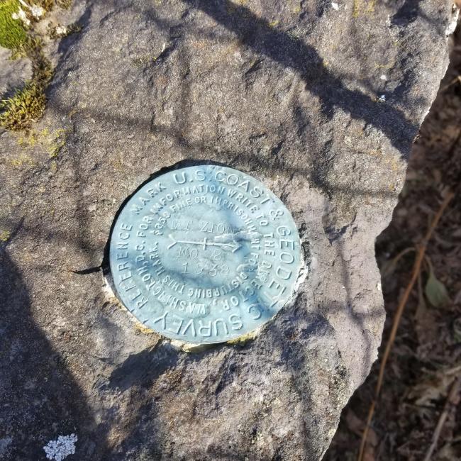 survey marker at the top