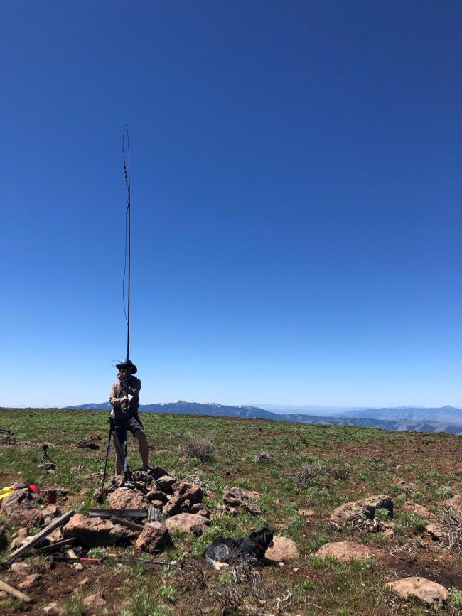 SOTA activator with rollup j-pole antenna on portable mast. 