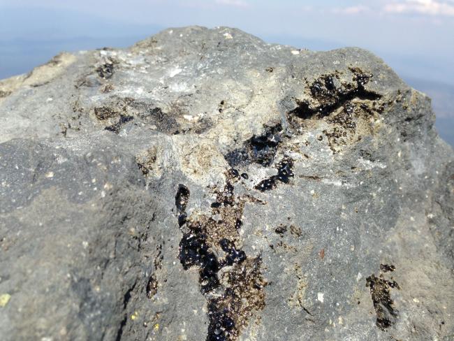 obsidian streaks on summit rocks