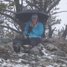 AE7AQ taking notes and staying dry