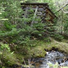 Old mine buildings alongside trail