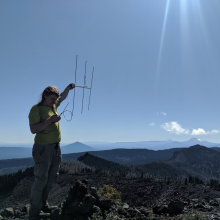 Image of me holding a yagi, courtesy of Will, KJ7FXU