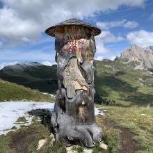 Nearly always Cross on summits, or other religious icon or monument