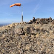 Working 2M FM from Pine Benchmark Summit.  Note Windsock for Paraglider take off zone.
