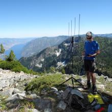 KG7EJT, Tim,  working 2M FM on "Olivia Mountain". Lake Chelan far below.