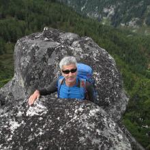 Tim, KG7EJT between summit boulders.  Watch your step behind.
