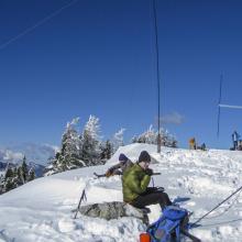 Tim, KG7EJT working 2M fm, foreground, with K7MAS working HF, background