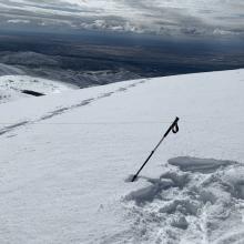 Summit with a little break from the wind and dark skies.  Far end of end-fed antenna.