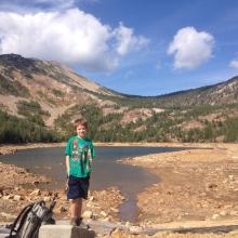Peyton at Carlton lake with False summit in the background.