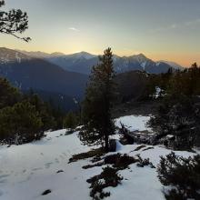 Sunset. Blue Mt on the horizon on the right, Gray Wolf and Baldy in front of the sun, Petunia closer on the left