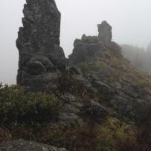 Two of three rock pillars on Buck Mtn summit, inverted L supported by closest on