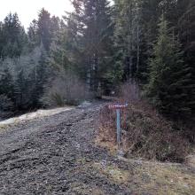 Locked gate about 1/2 mi from comm site